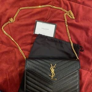 BLack Saint Laurent chained wallet in grain Poudre Embossed leather